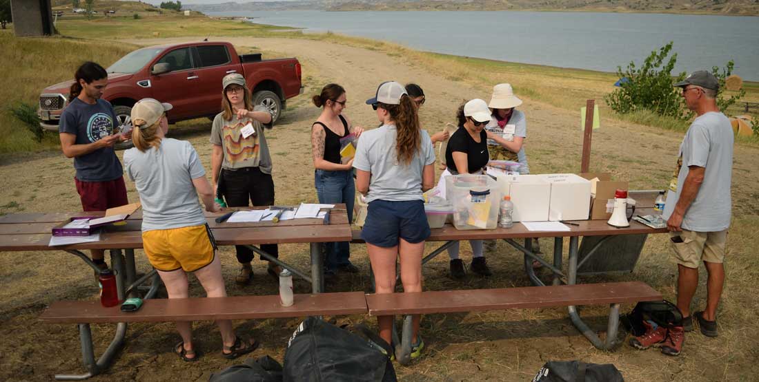 participants check in for dig field school